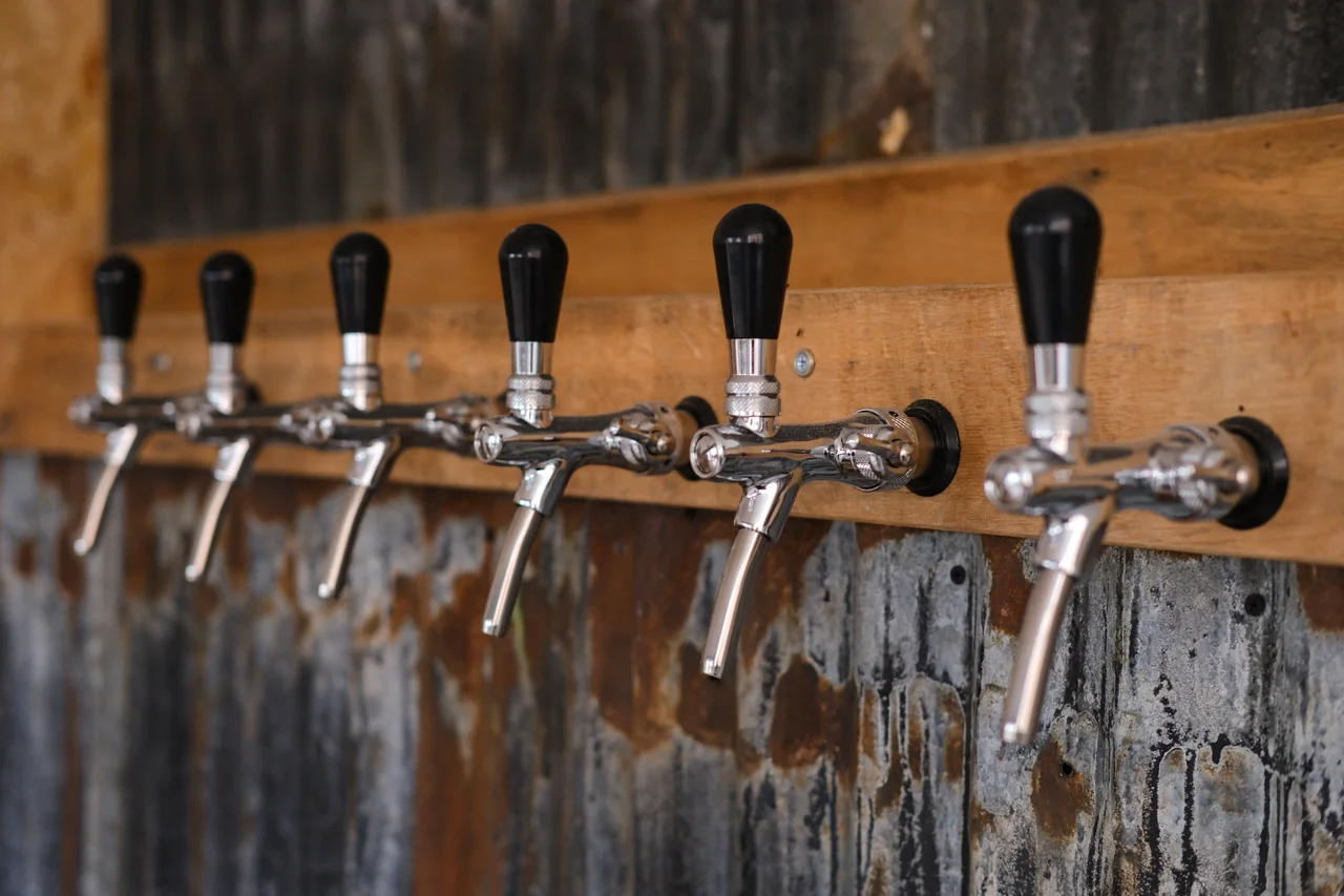 Chrome beer taps mounted on timber at tap.social